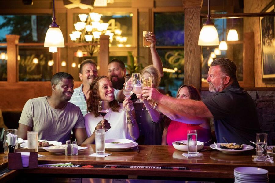 group of friends toasting at Emily's Bar and Restaurant